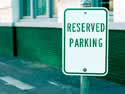 Show restricted parking spaces with Reserved Parking Signs.